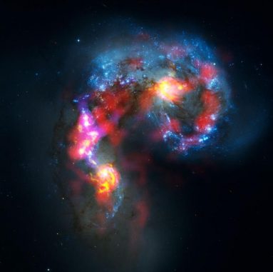Die miteinander verschmelzenden Antennengalaxien NGC 4038 und NGC 4039. (ALMA (ESO / NAOJ / NRAO). Visible light image: the NASA / ESA Hubble Space Telescope)