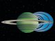 Diese künstlerische Darstellung verdeutlicht, wie geladene Wasserteilchen aus den Ringen in die Atmosphäre Saturns hinabregnen und eine Verringerung der atmosphärischen Helligkeit bewirken. (NASA / JPL-Caltech / Space Science Institute / University of Leicester)