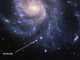 Die Supernova SN 2011fe (Pfeil) in der Feuerrad-Galaxie im Sternbild Großer Bär. Ihr Spektrum stellt einen Maßstab dar, an dem zukünftige Beobachtungen von Typ-Ia-Supernovae gemessen werden können. (B. J. Fulton, Las Cumbres Observatory Global Telescope Network)