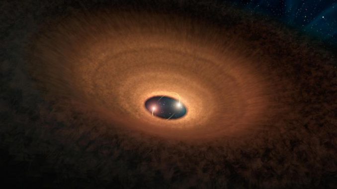 Künstlerische Darstellung der Materiescheibe um die beiden Zentralsterne des Systems YLW 16A. Alle 93 Tage kommt es zu einem Aufblinken des Systems. (NASA / JPL-Caltech)