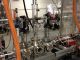 Das Foto zeigt ein Prototypgerät, das von dem MIT-Team entwickelt wurde, um einen sehr schmalen, hochenergetischen Elektronenstrahl für ein Experiment namens DarkLight zu produzieren. Das Gerät erfüllt die notwendigen Voraussetzungen, um ein hypothetisches Teilchen nachzuweisen, dessen Existenz in einer Theorie über Dunkle Materie vorhergesagt wird. (Photo courtesy of the researchers)