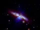 Die Supernova SN 2014J, aufgenommen vom Ultraviolet/ Optical Telescope an Bord des Swift-Satelliten. Die Explosion fand in der Galaxie M82 statt und ist mit einem Kreis markiert. (NASA / Swift / P. Brown, TAMU)