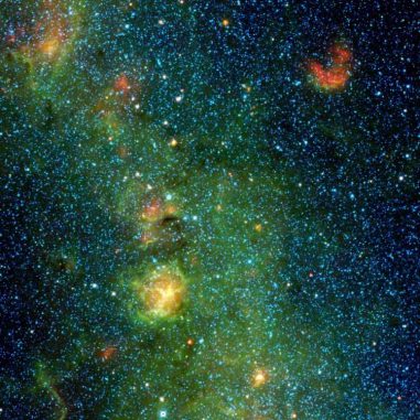 Der Trifidnebel im Sternbild Sagittarius (Schütze), aufgenommen vom Wide-field Infrared Survey Explorer (WISE). Es handelt sich um eine Gas- und Staubwolke, in der neue Sterne entstehen. (NASA / JPL-Caltech / UCLA)