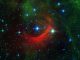 Der rote Bogen auf diesem Infrarotbild des Spitzer Space Telescope ist eine gigantische Schockwelle, die von einem schnellen Stern namens Kappa Cassiopeiae erzeugt wird. (NASA / JPL-Caltech)