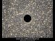 Künstlerische Darstellung des supermassiven Schwarzen Lochs im Zentrum der Zwerggalaxie M60-UCD1. (NASA, ESA, STScI-RCC14-41a)