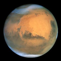 Der Mars, aufgenommen vom Weltraumteleskop Hubble. (NASA and The Hubble Heritage Team (STScI / AURA); Acknowledgment: J. Bell (Cornell U.), P. James (U. Toledo), M. Wolff (SSI), A. Lubenow (STScI), J. Neubert (MIT / Cornell))