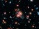 Dieses Bild basiert auf Daten der Weltraumteleskope Spitzer und Hubble und zeigt den Galaxienhaufen SpARCS1049+56. (NASA / STScI / ESA / JPL-Caltech / McGill)