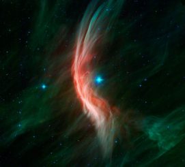 Dieses Infrarotbild stammt vom Spitzer Space Telescope. Es zeigt, wie stellare Winde von dem sich schnell bewegenden Stern Zeta Ophiuchi eine Schockwelle erzeugen, wenn sie auf das interstellare Medium treffen. (NASA / JPL-Caltech)