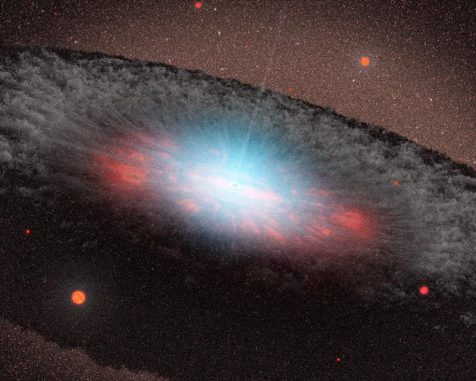 Diese Illustration zeigt ein supermassives Schwarzes Loch im Zentrum einer Galaxie. Die bläulichen Farbtöne repräsentieren Strahlung, die von der Materie in der direkten Umgebung des Schwarzen Lochs emittiert wird. Die graue Struktur, die das Schwarze Loch umgibt, besteht aus Gas und Staub. (NASA / JPL-Caltech) Diese Illustration zeigt ein supermassives Schwarzes Loch im Zentrum einer Galaxie. Die bläulichen Farbtöne repräsentieren Strahlung, die von der Materie in der direkten Umgebung des Schwarzen Lochs emittiert wird. Die graue Struktur, die das Schwarze Loch umgibt, besteht aus Gas und Staub. (NASA / JPL-Caltech)