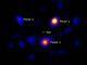 Der Stern HR 8799 (in der Mitte hier nicht sichtbar) und drei seiner vier Planeten, aufgenommen vom Hale Telescope. (NASA / JPL-Caltech / Palomar Observatory)