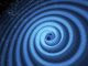 Diese künstlerische Illustration zeigt die Verschmelzung zweier Schwarzer Löcher und die von ihnen emittierten Gravitationswellen. In Wirklichkeit würde die Region in der Nähe der Schwarzen Löcher hochgradig verzerrt erscheinen, und die Gravitationswellen wären viel zu klein, um optisch beobachtet zu werden. (Image: T. Pyle / LIGO)