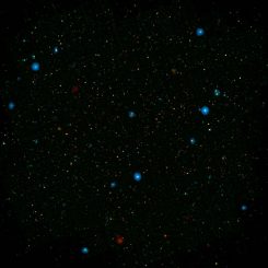 Die blauen Punkte in diesem Galaxienfeld, dem COSMOS Field, stellen Galaxien mit supermassiven Schwarzen Löchern dar, die hochenergetische Röntgenstrahlen emittieren. (NASA / JPL-Caltech)