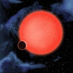 Künstlerische Darstellung des Exoplaneten GJ1214b und seinem Zentralstern (NASA, ESA, and D. Aguilar (Harvard-Smithsonian Center for Astrophysics))