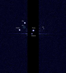 Das Pluto-System mit dem neu entdeckten Mond P5. (NASA, ESA, and M. Showalter (SETI Institute))