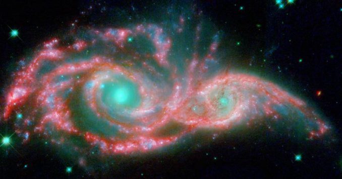 Die verschmelzenden Galaxien NGC 2207 und IC 2163, basierend auf Daten der Weltraumteleskope Spitzer und Hubble. (NASA, ESA / JPL-Caltech / STScI / D. Elmegreen (Vassar)) Die verschmelzenden Galaxien NGC 2207 und IC 2163, basierend auf Daten der Weltraumteleskope Spitzer und Hubble. (NASA, ESA / JPL-Caltech / STScI / D. Elmegreen (Vassar))