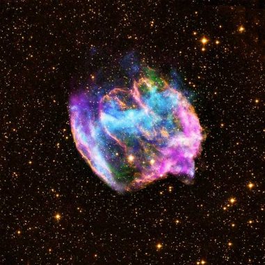 Der Supernova-Überrest W49B, basierend auf Daten des Chandra X-ray Observatory, des Palomar Observatoriums und des Very Large Array. (X-ray: NASA / CXC / MIT / L.Lopez et al.; Infrared: Palomar; Radio: NSF / NRAO / VLA)
