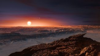 Künstlerische Darstellung der Oberfläche des Planeten Proxima b, der den roten Zwergstern Proxima Centauri umkreist. (Credit: ESO / M. Kornmesser)
