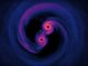 Screenshot aus dem unten eingebetteten Video der Simulation zweier einander umkreisender supermassiver Schwarzer Löcher. (Credits: NASA’s Goddard Space Flight Center)