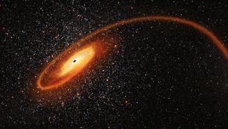 Illustration des mittelschweren Schwarzen Lochs beim Auseinanderreißen eines Sterns. (Credits: NASA, ESA and D. Player (STScI))