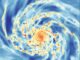 Computersimulation einer Galaxie in Frontalansicht. Rot deutet auf höhere Gasdichten hin, Blau auf geringere. (Credits: Semenov et al., 2021)
