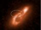 Ein digital bearbeitetes Hubble-Bild einer Galaxie, in der ein schneller Radioblitz beobachtet wurde. Die ovale Region markiert das Ursprungsgebiet des Radioblitzes. (Credits: SCIENCE: NASA, ESA, Alexandra Mannings-UC Santa Cruz; Wen-fai Fong- Northwestern; IMAGE PROCESSING: Alyssa Pagan-STScI)