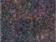 Falschfarbenbild der ferninfraroten Emission eines massereichen Protogalaxienhaufens (Kreis) aus der Epoche rund 1,4 Milliarden Jahre nach dem Urknall. (Credit: NASA / ESA / Herschel; Miller et al.)