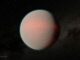 Künstlerische Darstellung des Planeten GJ 1214 b, einem Mini-Neptun, der wahrscheinlich in eine dampfhaltige, dunstige Atmosphäre eingehüllt ist. (Credits: NASA / JPL-Caltech / R. Hurt (IPAC))