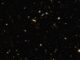 Eine Tiefenbeobachtung der NIRCam an Bord des James Webb Space Telescope. Die markierten Galaxien liegen in einer filamentartigen Struktur im frühen Universum. (Credits: NASA, ESA, CSA, Feige Wang (University of Arizona), and Joseph DePasquale (STScI))